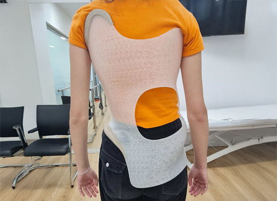 Rigid spinal brace on patient