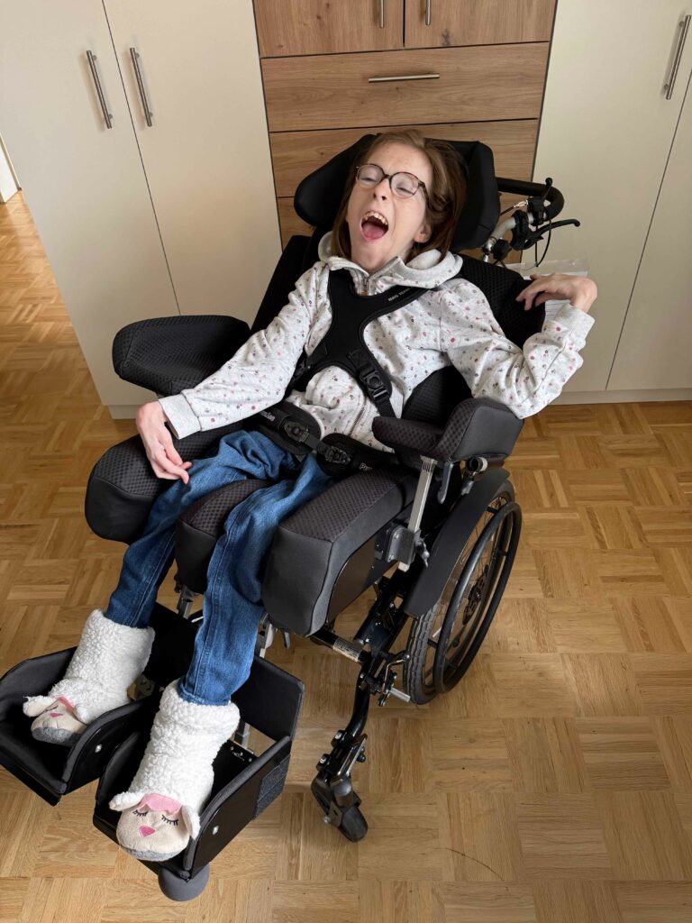 Esther in a 3D printed seat