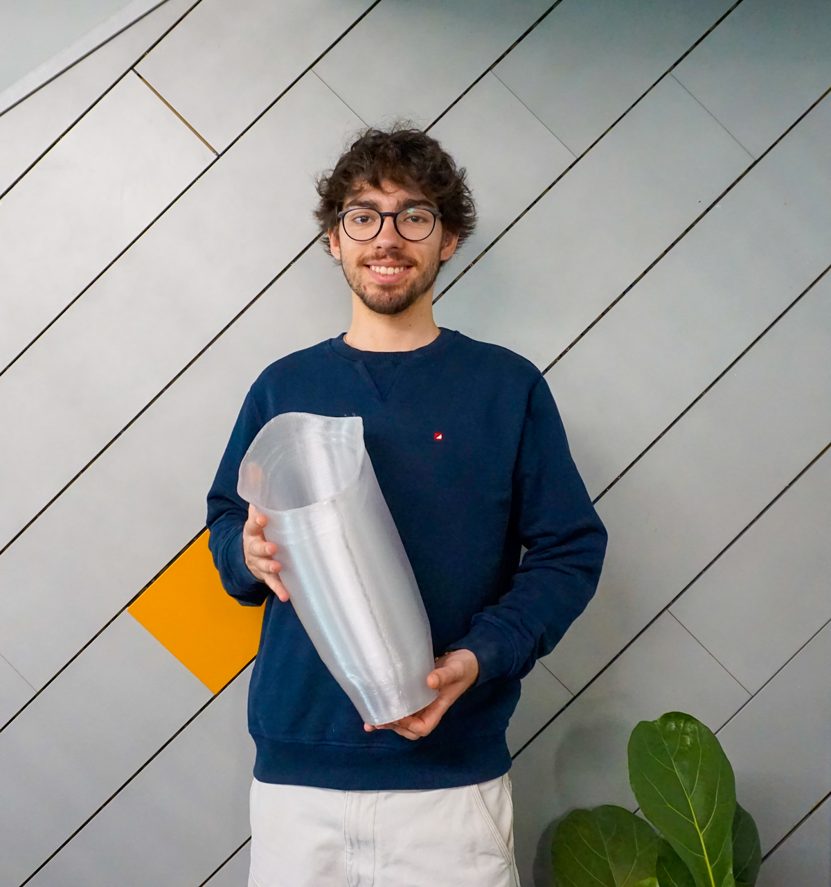 Person holding a 3D printed prosthetic socket